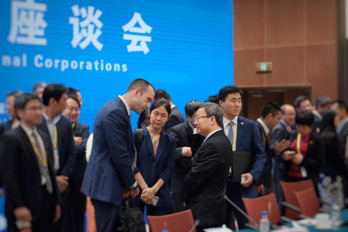 USCBC Vice President Jacob Parker in a talk with Vice Minister of Commerce Wang Shouwen after the Multinational Companies Symposium