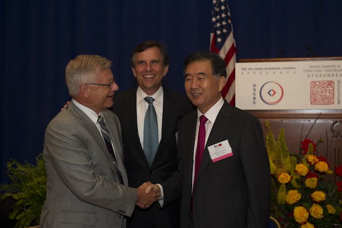 Emerson President and CEO Ed Monser, Emerson Chair and CEO David Farr, and Vice Premier Wang Yang at the dinner